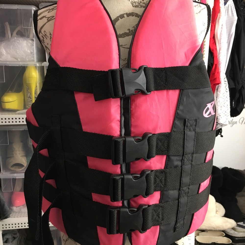 Woman’s pink life jacket